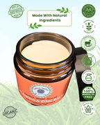 A jar of Tallow Nation Calendula Tallow Zinc Balm 100g with badges around the sides and made with natural ingredients along the top on a grass background.